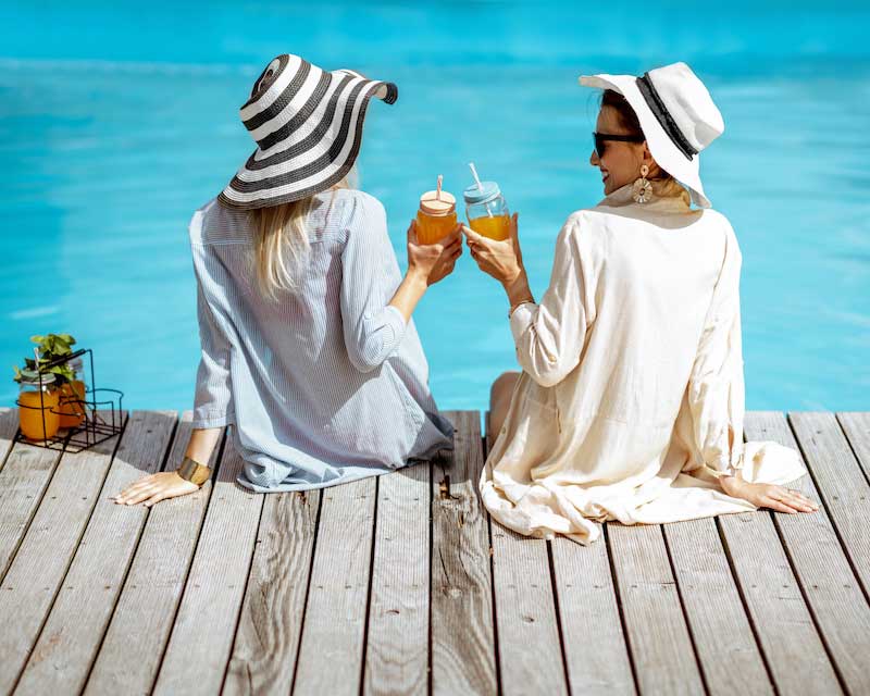 Women enjoying a drink at the pool at florida vacation rental